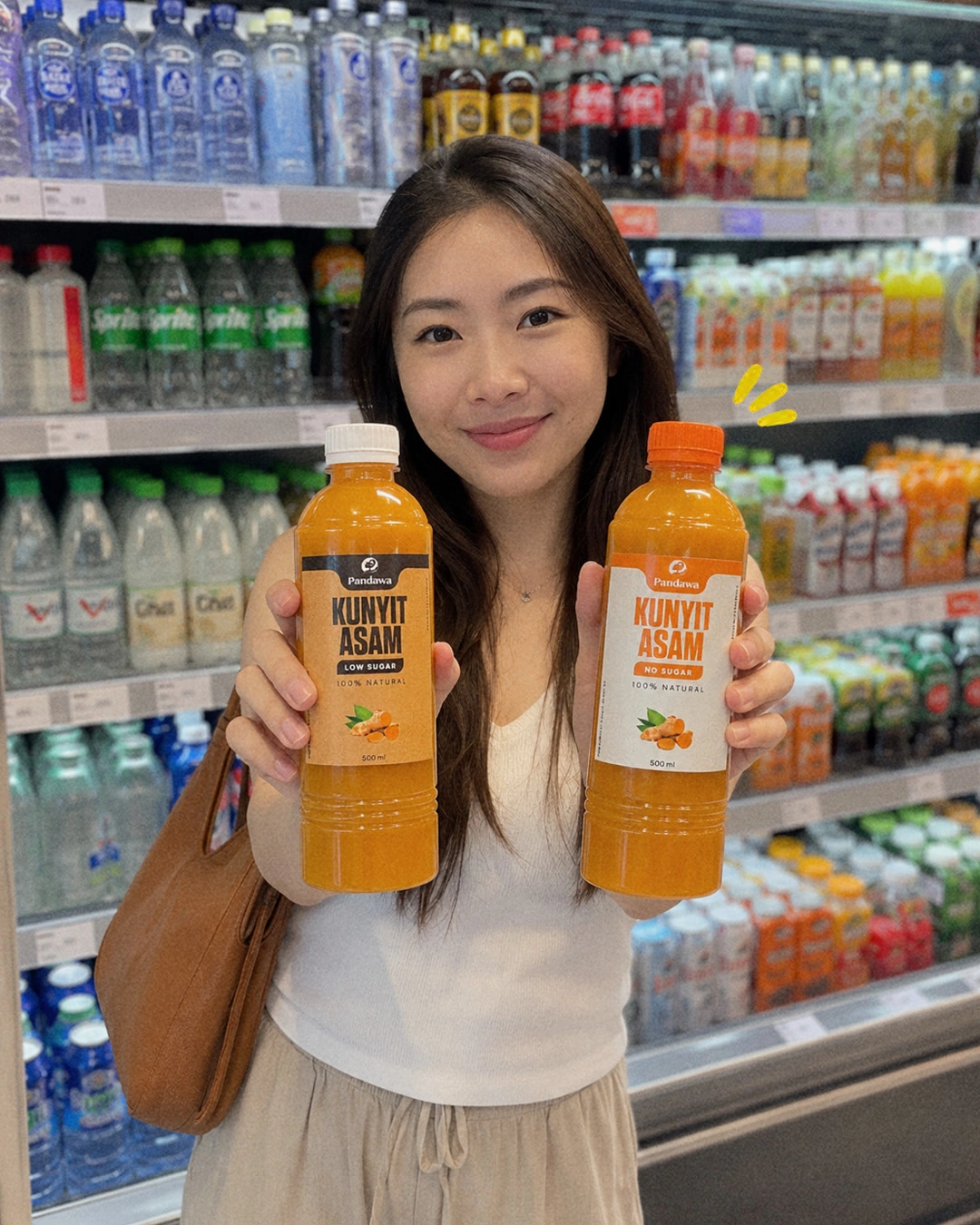 Customer holding Pandawa bottles in a supermarket